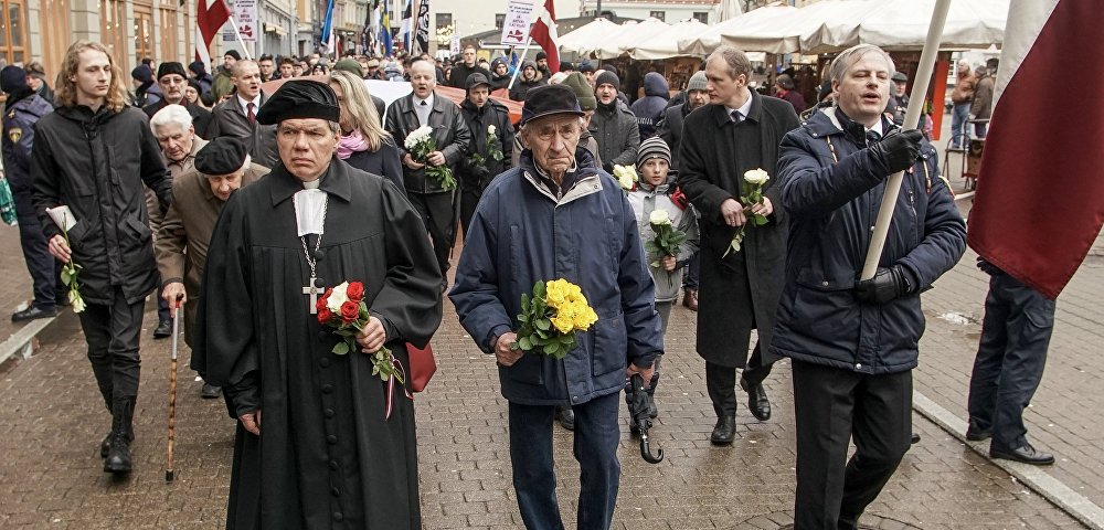 Шествие легионеров Waffen SS в Риге. Во главе колонны Пастор Гунтис Калме, 16 марта 2019 Шествие легионеров Waffen SS в Риге. Во главе колонны Пастор Гунтис Калме, 16 марта 2019